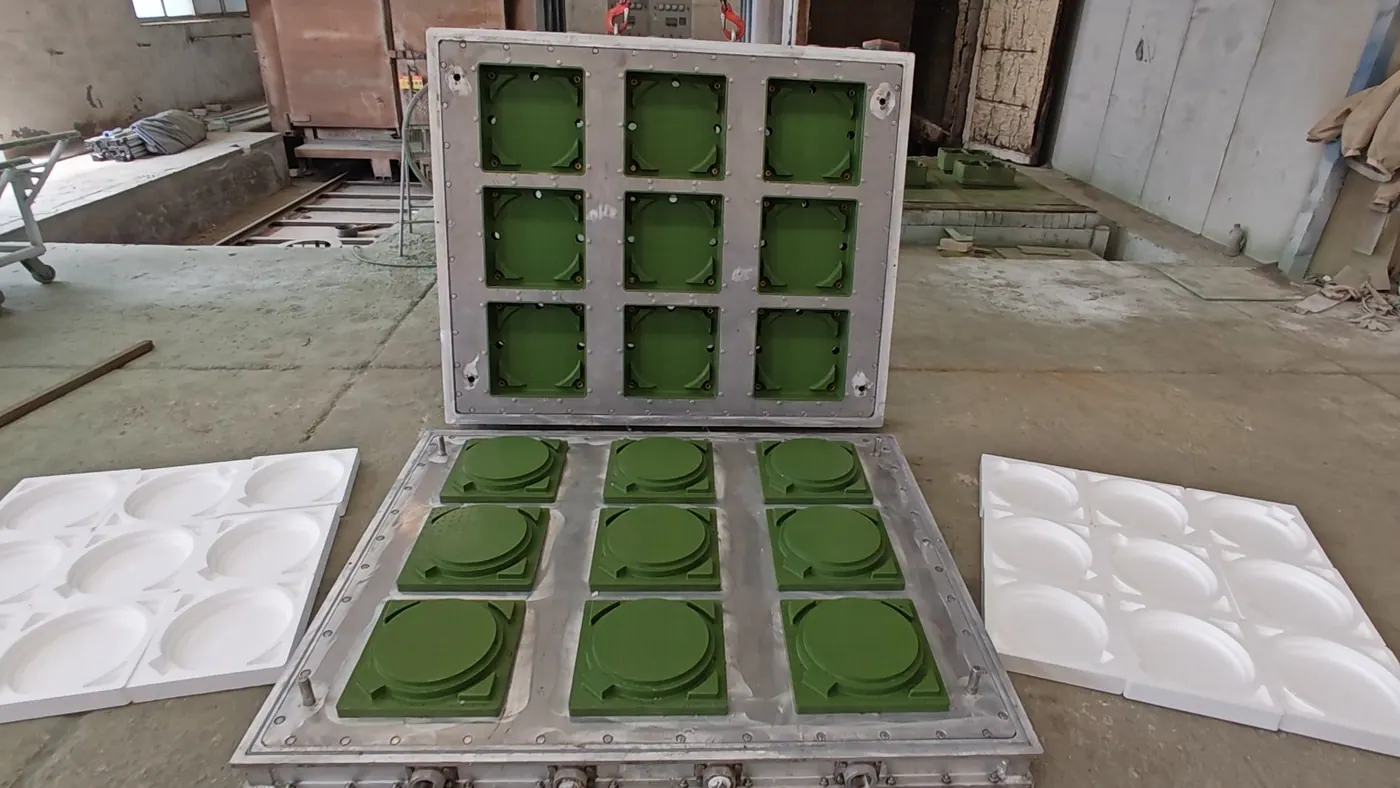 Open EPS mold with the foam parts it produces laid beside it